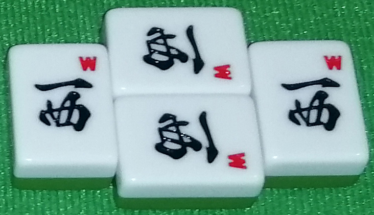 A called added open kan. The tiles pictured are the four Sha tiles.
