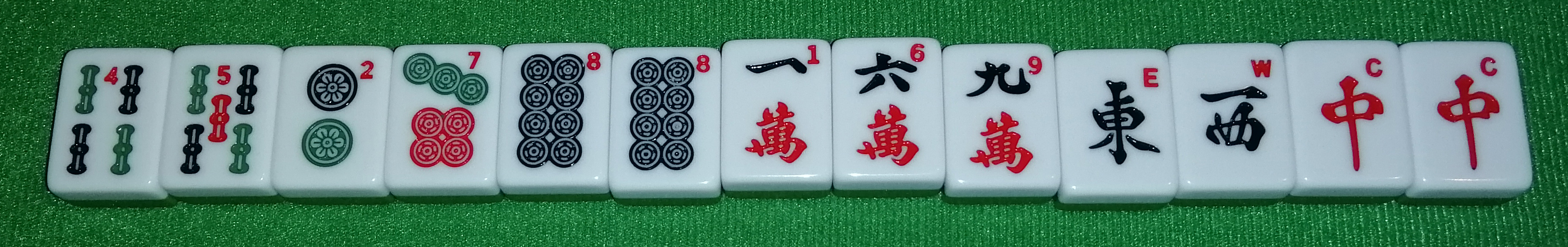 A potential hand. From left to right: 4-Sou, 5-Sou, 2-Pin, 7-Pin, 8-Pin, 8-Pin, 1-Wan,
6-Wan, 9-Wan, Ton, Sha, Chun, Chun.