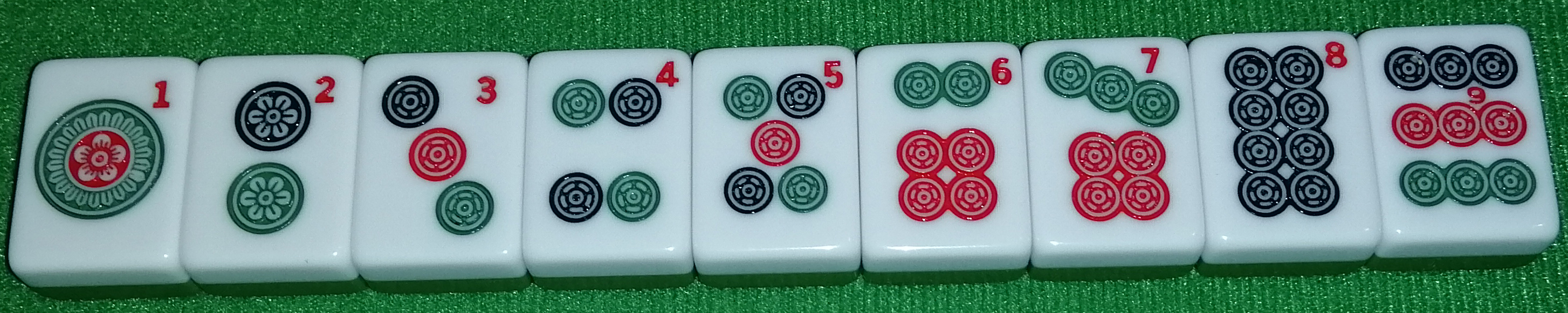 Nine pin tiles, numbered one through nine.